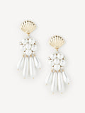 A pair of gold and white shell-shaped dangle earrings with pearl-like beads and small clear rhinestone accents, displayed on a clean off-white background.