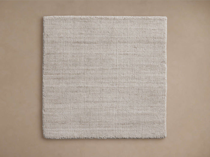 Selby Performance Rug Swatch in a neutral beige color, square shape on a neutral background, showcasing texture and weave.