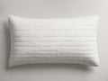 White rectangular Selkie Linen Sham, quilted with horizontal stitching and subtle texture, lying flat.