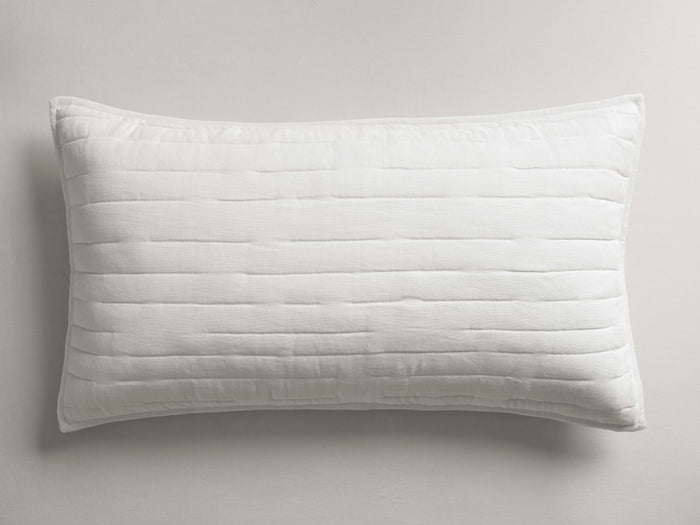 White rectangular Selkie Linen Sham, quilted with horizontal stitching and subtle texture, lying flat.