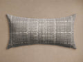 Horizontal Siene Outdoor Lumbar Pillow with a textured grey and off-white abstract woven pattern, displayed on a plain beige background.