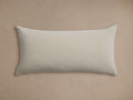 Sienna Outdoor Lumbar Pillow, light beige/greige, rectangular with velvety texture, horizontally oriented on a neutral background.