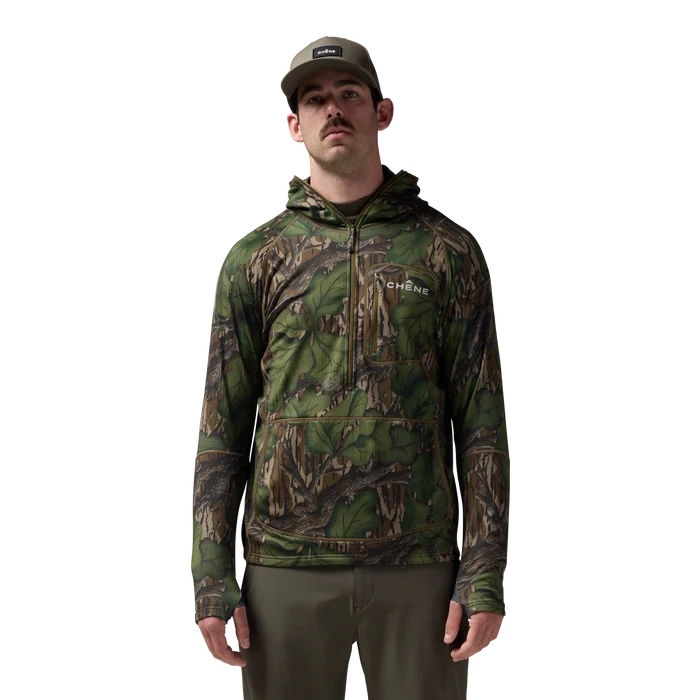 Sixty Series Technical Fleece Half Zip with Hood in Mossy Oak Full Foliage, on model #mossy_oak_full_foliage