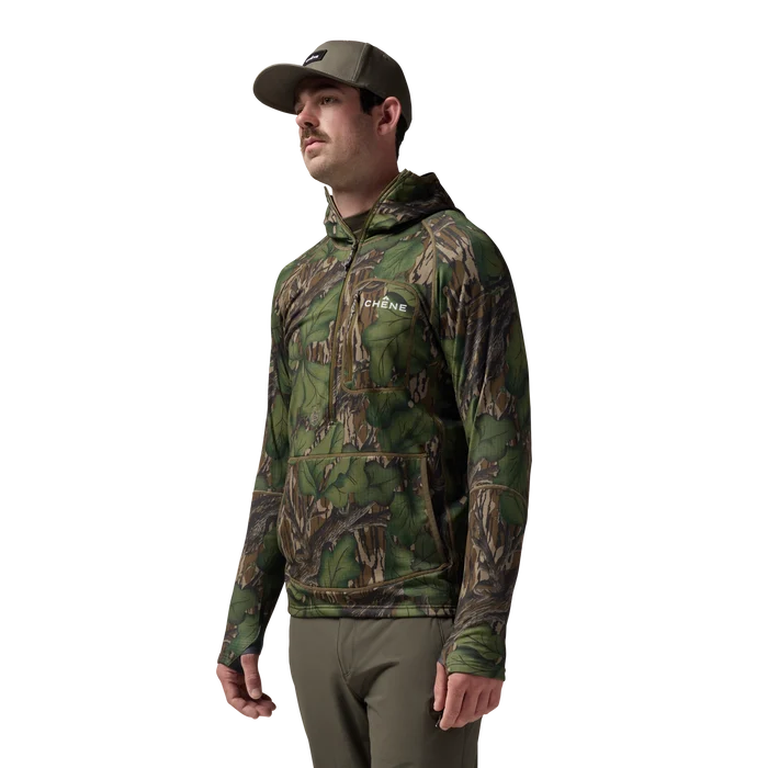 Sixty Series Technical Fleece Half Zip with Hood in Mossy Oak Full Foliage, on model #mossy_oak_full_foliage