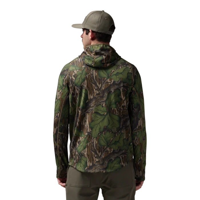 Sixty Series Technical Fleece Half Zip with Hood in Mossy Oak Full Foliage, on model #mossy_oak_full_foliage