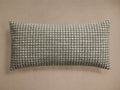 Horizontal Sorisole Lumbar Pillow featuring a dark green and off-white subtle houndstooth-inspired woven pattern.