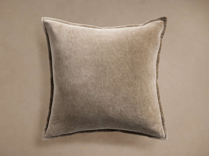 Front view of the beige Stone Washed Velvet Pillow, featuring a visibly distressed velvet texture.