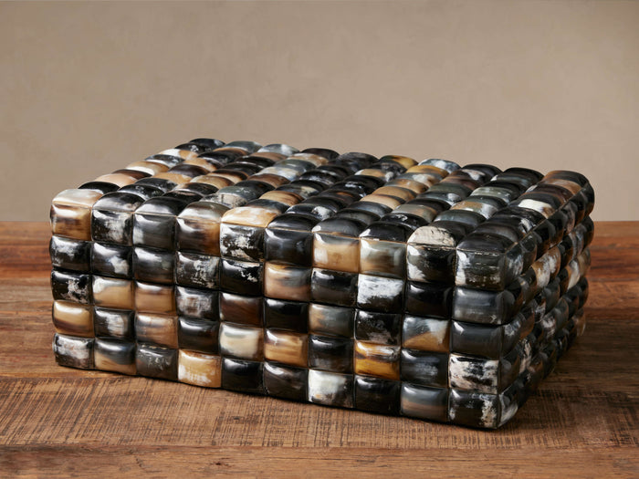 Tabor Box, a rectangular box with natural horn tiles in black, white, gray, and brown, on a wooden surface.