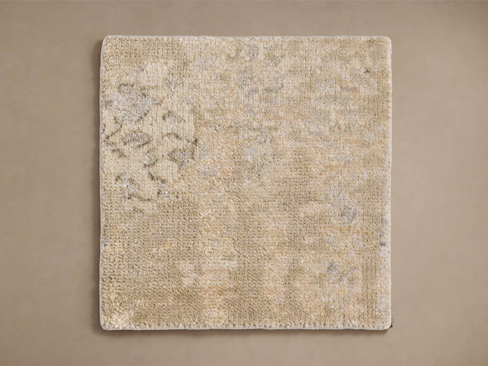 Tansey Hand-Knotted Rug in beige tones, showcasing subtle textures and a lightly patterned surface, square shape, on a plain background.