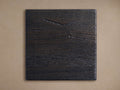Square dark "Telegraph" finish board, prominent horizontal wood grain texture, slightly rustic, on a light brown background.