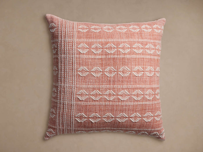 Tulah Outdoor Floor Pillow, square, salmon with textured off-white geometric patterns and striped left border.