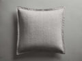 Light gray Tulaya Cotton Sham, square, featuring a subtle quilted pattern, soft wrinkles, and frayed edges, against a gray background.