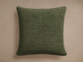 Square Turner Pillow in deep olive green with rich horizontal textured cotton-rayon front on a plain light brown background.