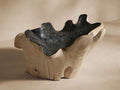 Vanora Curly Bowl, organic natural teak wood with a light exterior and dark crackled interior texture, shown angled.