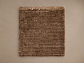 Vida Hand-Knotted Rug Swatch, a rectangular sample with textured light and dark brown stripes, laid flat on a neutral surface.