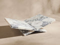 White marble Viola Book Stand with prominent grey veining, angled open like a book, set against a light neutral background.