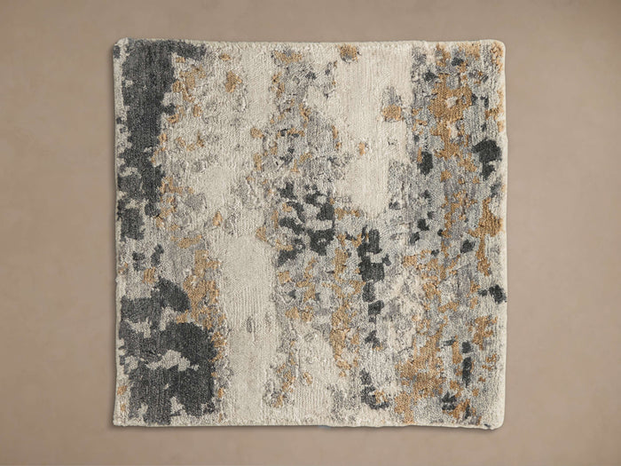Viona Hand-Knotted Rug Swatch: Rectangular, textured sample with abstract design in off-white, dark grey, and gold.
