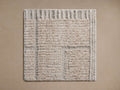 Square Walker Performance Rug Swatch in light beige/grey with varied textures including ribbed borders and a shaggy center.