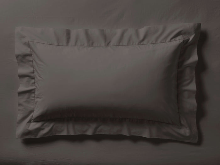 Dark gray Washed Percale Sham, lying flat, featuring a wide flange with mitered corners and visible decorative topstitch.