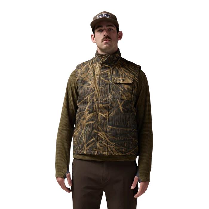Waxed Canvas Goose Down Vest in Mossy Oak Original Shadow Grass, on model #mossy_oak_original_shadow_grass
