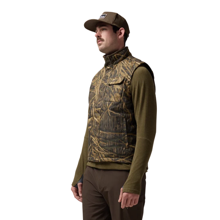 Waxed Canvas Goose Down Vest in Mossy Oak Original Shadow Grass, on model #mossy_oak_original_shadow_grass