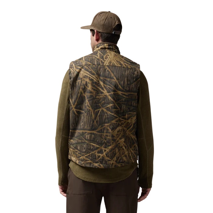 Waxed Canvas Goose Down Vest in Mossy Oak Original Shadow Grass, on model #mossy_oak_original_shadow_grass