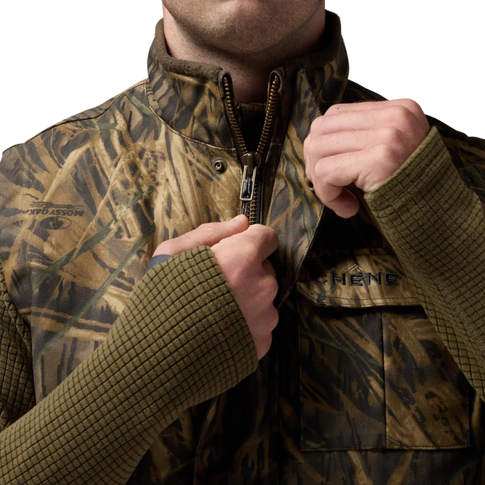 Waxed Canvas Goose Down Vest in Mossy Oak Original Shadow Grass, on model #mossy_oak_original_shadow_grass