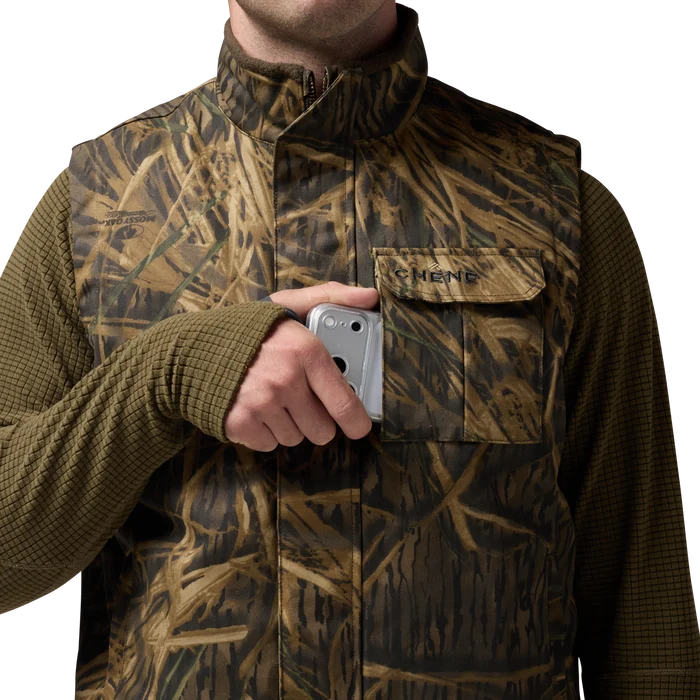 Waxed Canvas Goose Down Vest in Mossy Oak Original Shadow Grass, on model #mossy_oak_original_shadow_grass