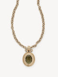 A gold-toned chain necklace with a textured oval pendant featuring a dark olive-green stone, set against a plain off-white background.